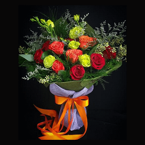 candy crush round hand tied bouquet A beautiful bouquet of red, orange roses, green lisianthus, and elegant seasonal greenery.